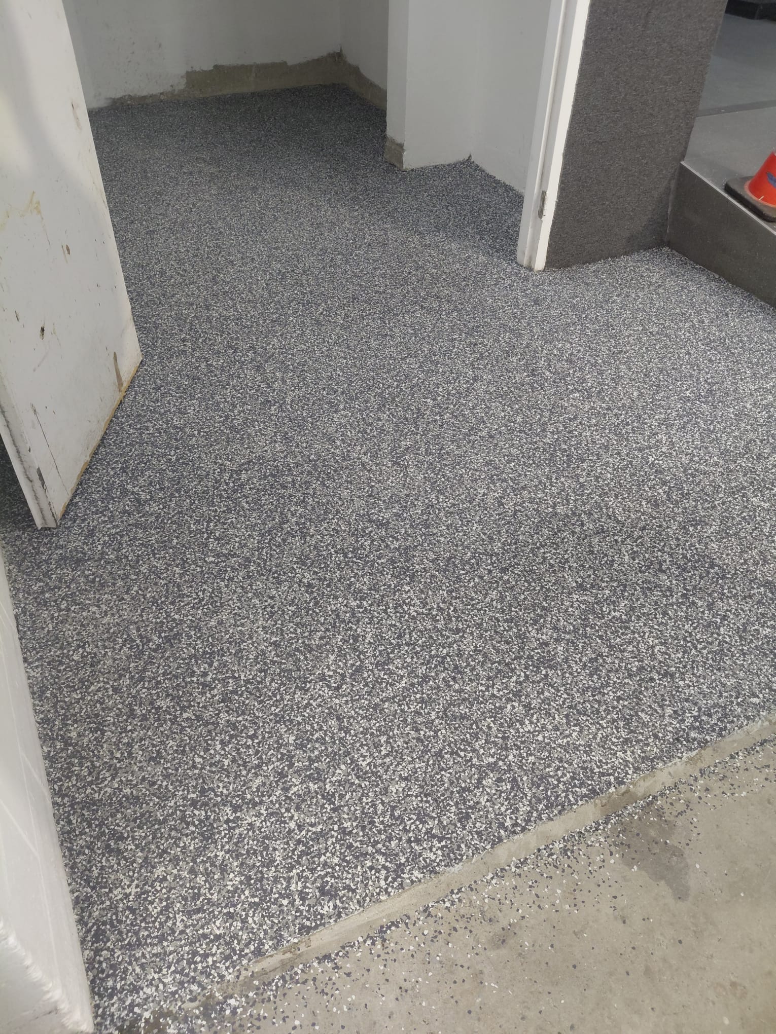 After: creative epoxy seamless coating in the Edgewater Gardens bin room, Gold Coast